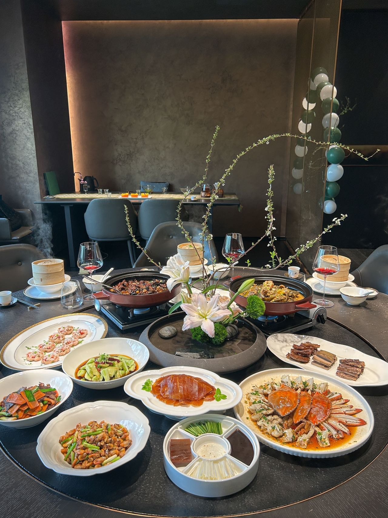 A contemporary Chinese meal at Qinghe in Wuhan, with seafood, vegetables, soup and other shared dishes.