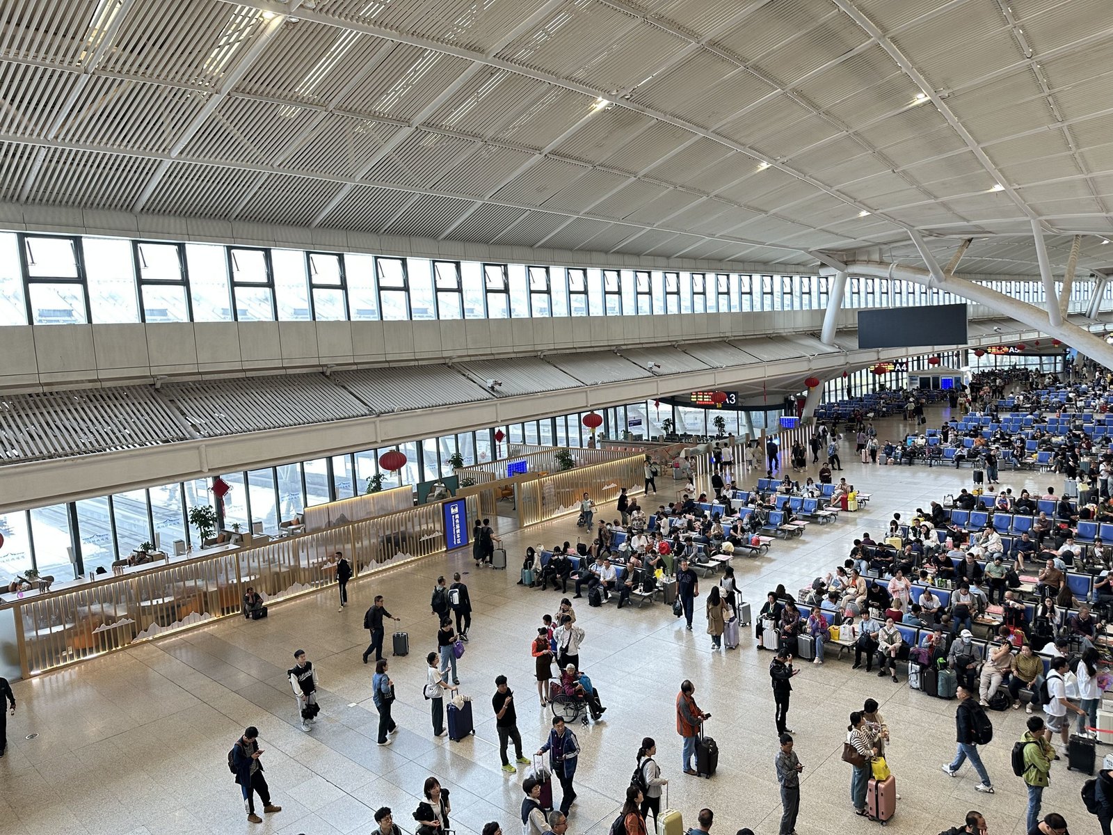 The spacious concourse at Wuhan Railway Station, where transfers and waiting time form part of a journey.