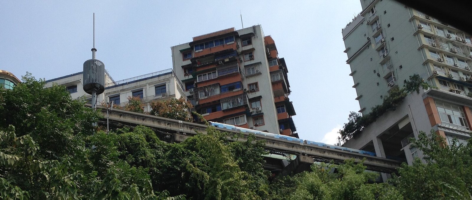 A train passes through a residential building at Liziba in Chongqing.