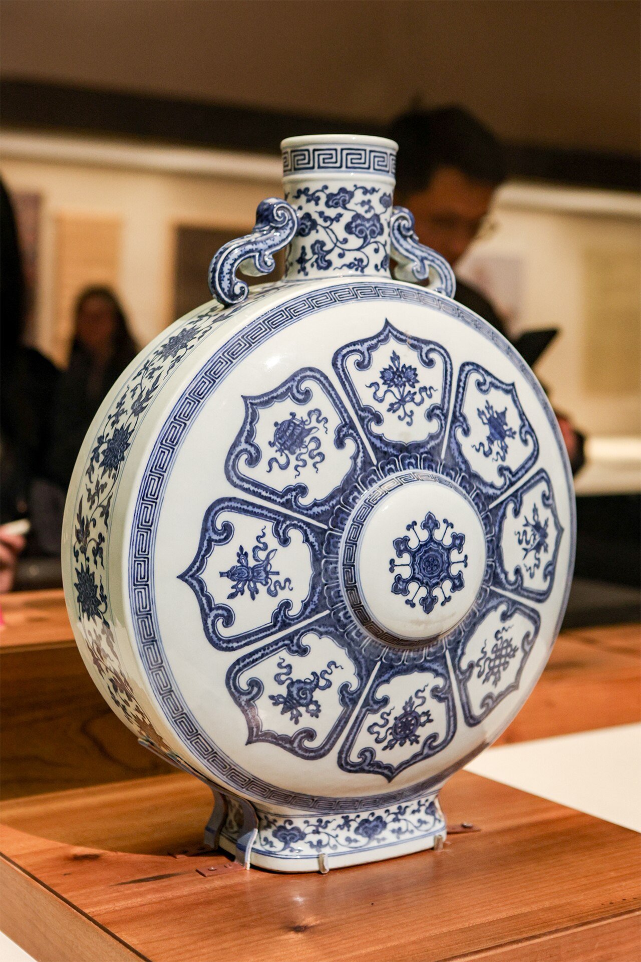 A historic blue-and-white porcelain flask with decorative motifs.