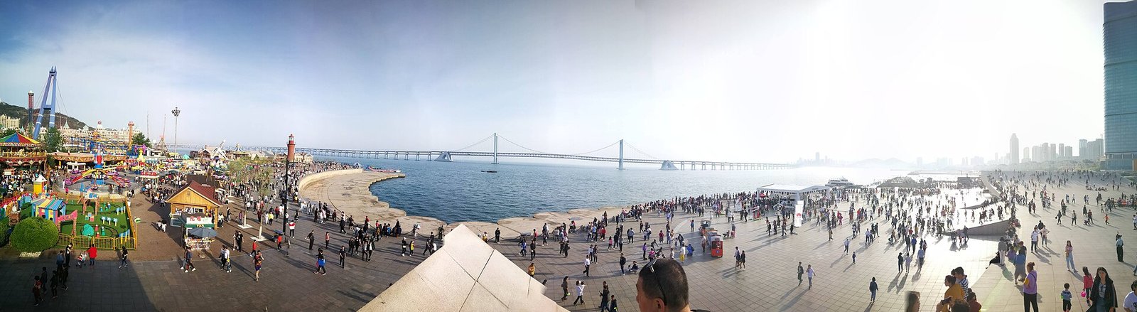 The seafront promenade and broad open space at Xinghai Square in Dalian.